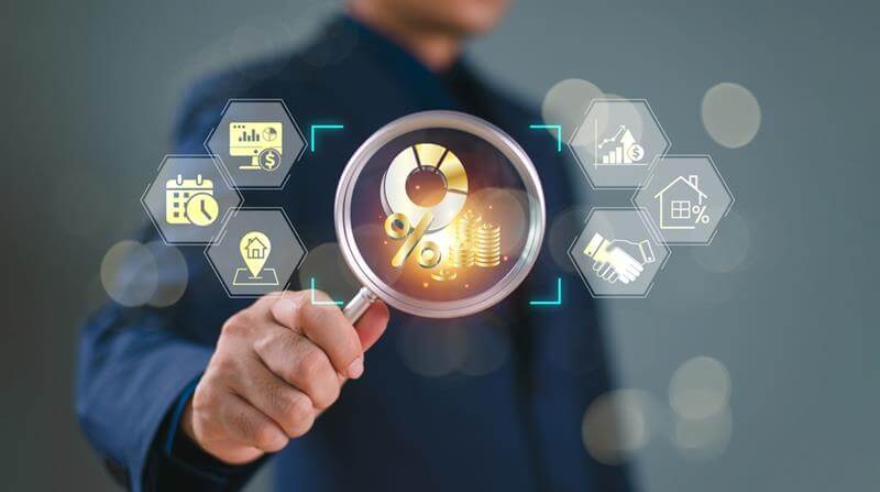 Businessman use magnifying glass search fund icon on virtual screen.